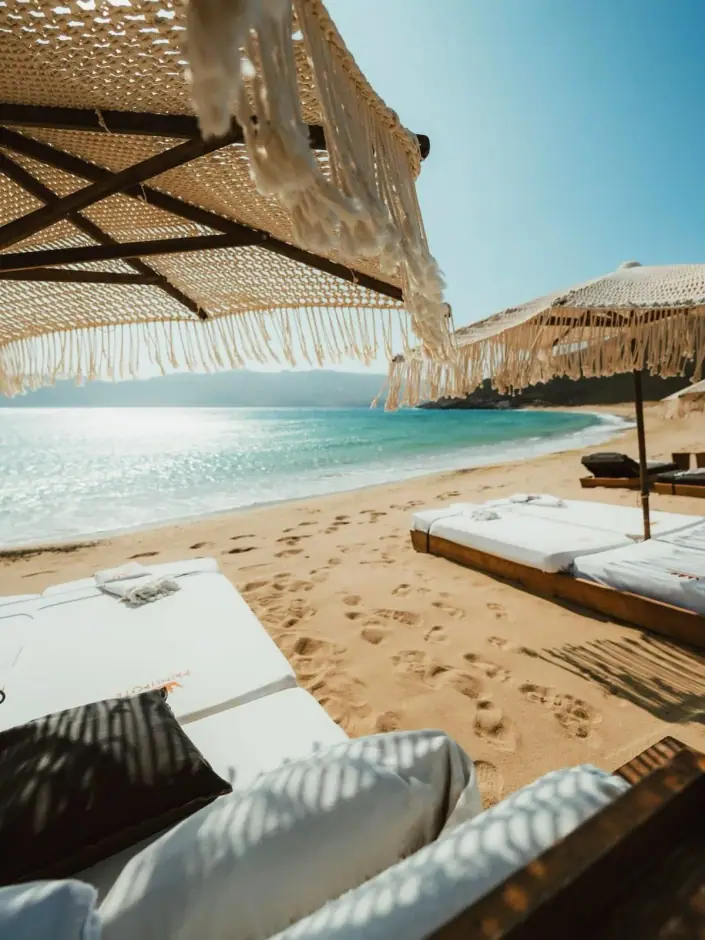 Beachfront Daybeds — arranged in Mykonos by Mykonos Access